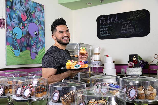 Owner Ricardo Gudino poses with cupcakes at Caked Las Vegas, 7175 W. Lake Mead Blvd., Tuesday, Oct. 29, 2019. Originally The Cupcakery, Gudino changed the name of the bakery to promote his custom-made cakes, including wedding cakes.