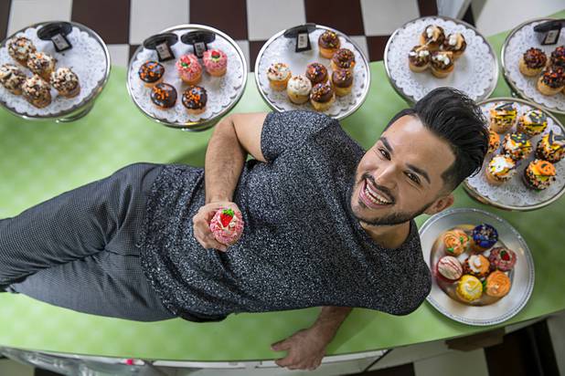Owner Ricardo Gudino poses with cupcakes at Caked Las Vegas, 7175 W. Lake Mead Blvd., Tuesday, Oct. 29, 2019. Originally The Cupcakery, Gudino changed the name of the bakery to promote his custom-made cakes, including wedding cakes.