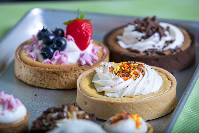 Samples of mini-pies, tarts and cakes are displayed at Caked ...