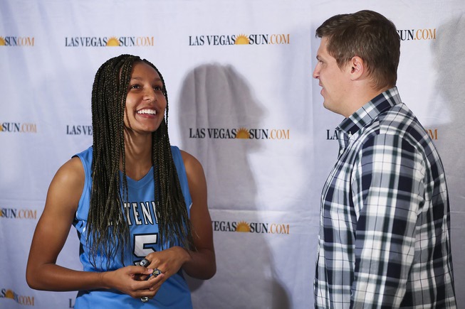 Centennial high school basketball player Jade Thomas is interviewed by ...