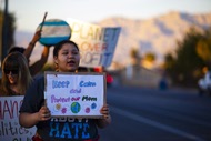 Activist Alianna Diaz, 25, holds a sign and chants in front of the Bureau of Land Management office in protest of attempts by the BLM to expedite public land leases to oil and gas developers, Tuesday, Nov. 12,&nbsp;2019.