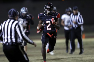 Las Vegas’ Miles Davis (2) breaks through the Palo Verde defense for a touchdown during a Mountain Regional quarterfinal game at Las Vegas High School Friday, Nov. 15,&nbsp;2019.