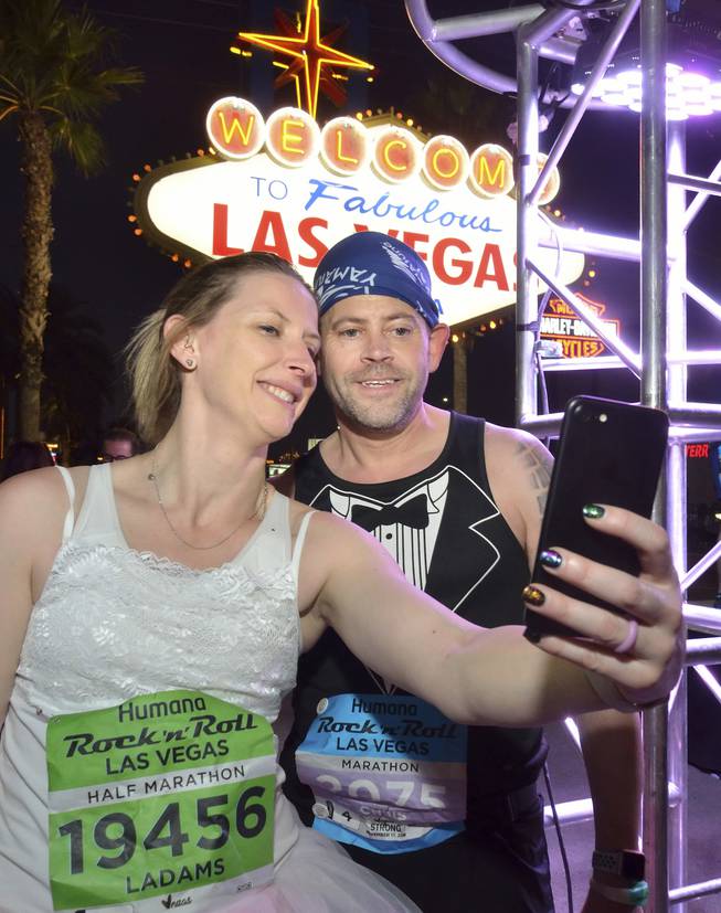 Lisa and Chris Evans of Yorkshire, England, are shown during the Run Thru Wedding event at the ���Welcome to Fabulous Las Vegas��� sign during the Rock 'n' Roll Marathon in Las Vegas on Sunday, Nov. 17, 2019. The couple renewed their vows after 20 years of marriage. (Bill Hughes/Las Vegas News Bureau)