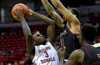 UNLV Rebels guard Amauri Hardy (3) gets shut down by Texas State Bobcats guard DeShawn Davidson (0) in the second half during a game at the Thomas & Mack Center Wednesday, Nov. 20, 2019. 