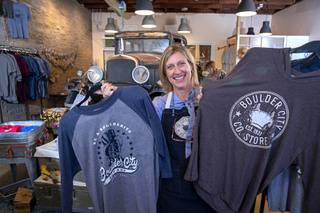 Tara Leon-Bertoli poses with Boulder City-themed clothing at the Boulder City Company Store in Boulder City Wednesday, Nov. 27, 2019. Tara co-owns the business with her husband Dr. Troy Bertoli. 