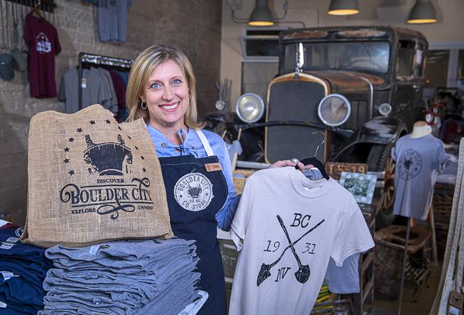 Tara Leon-Bertoli poses with Boulder City-themed merchandise in the Boulder ...