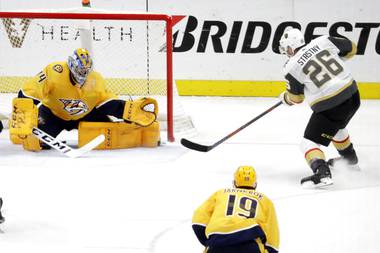 Vegas Golden Knights center Paul Stastny (26) scores the winning goal against Nashville Predators goaltender Juuse Saros (74), of Finland, in overtime of an NHL hockey game Wednesday, Nov. 27, 2019, in Nashville, Tenn. The Golden Knights won 4-3. 

