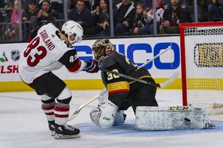 Golden Knights' goaltender Malcolm Subban (30) blocks a shot by Arizona Coyotes' right wing Conor Garland (83) in a shootout during a game at T-Mobile Arena, Friday, Nov. 29, 2019.