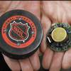 A FoxTrax NHL regulation hockey puck, unveiled on January 18, 1996. The puck was indistinguishable from a regular one in physical appearance but had a spot-lighting feature that made it change colors when viewed on TV. 