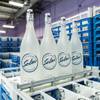 Plastic crates hold glass bottles at the Solus Sustainable Hydration plant in North Las Vegas, Monday, Dec. 9, 2019. Solus is a spring water that is regionally sourced, available in still or sparkling, and bottled in reusable glass.