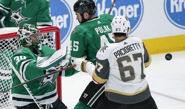 Vegas Golden Knights forward Max Pacioretty (67) battles Dallas Stars goaltender Ben Bishop (30) and defenseman Roman Polak (45) for a rebound during the second period of an NHL hockey game Friday, Dec. 13, 2019, in Dallas.

