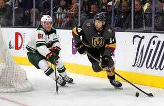 Vegas Golden Knights defenseman Nicolas Hague (14) skates against Minnesota Wild's Brennan Menell (61) during a game at T-Mobile Arena Tuesday, Dec. 17, 2019.