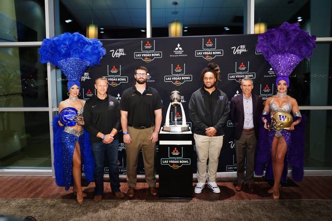 Coach Bryan Harsin and John Molchon of the Boise State University Broncos with Benning Potoa'e and coach Chris Petersen of the University of Washington Huskies during the 2019 Las Vegas Bowl Media Opportunity (Photo by Joe Faraoni / ESPN Images)
