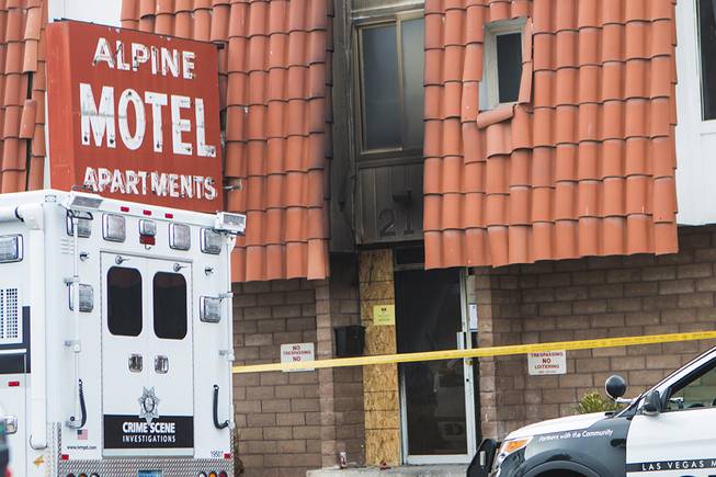 Metro Police crime scene investigators and Las Vegas Fire & Rescue gather Sunday, Dec. 22, 2019, at the Alpine Motel Apartments, 213 N. Ninth St., where a fire killed six people and injured 13 others the previous day.