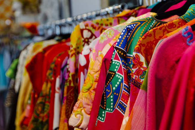 Patina Decor - A selection of colorful garments are displayed at Patina ...