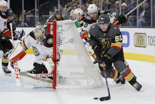 Vegas Golden Knights left wing Tomas Nosek (92) skates around Anaheim Ducks left wing Nicolas Deslauriers (20) during the second period of an NHL hockey game Tuesday, Dec. 31, 2019, in Las Vegas.
