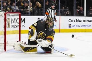 Vegas Golden Knight goalie Marc-Andre Fleury (29) deflects the puck during a game against the Pittsburgh Penguins at T-Mobile Arena Tuesday, Jan. 7, 2020.