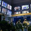 In this Nov. 18, 2019, photo, patrons visit the sports betting area of Twin River Casino in Lincoln, R.I. Gambling regulators and sports books in several U.S. states are preparing to allow gamblers to bet on XFL games once the league's season begins in early February. 
