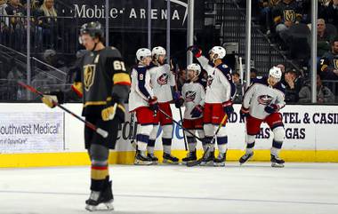 Columbus Blue Jackets celebrate a goal by center Alexander Wennberg (10) in the third period during a game against the Columbus Blue Jackets at T-Mobile Arena Saturday, Jan. 11, 2020. Vegas Golden Knights right wing Mark Stone (61) skates by at left.