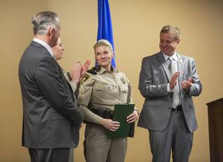 Detective Stephanie Ward, center, smiles onstage during a commendation ceremony at Metro headquarters in downtown Las Vegas on Wednesday, Jan. 15, 2020. Miranda Alam/Special to the Weekly