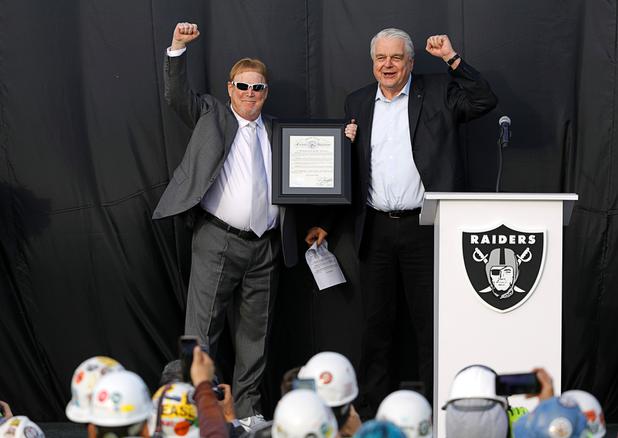 Las Vegas Raiders owner Mark Davis, left, and Nevada Governor Steve Sisolak celebrate during a news conference, officially renaming the Oakland Raiders to the Las Vegas Raiders, in front of Allegiant Stadium Wednesday, Jan. 22, 2020.