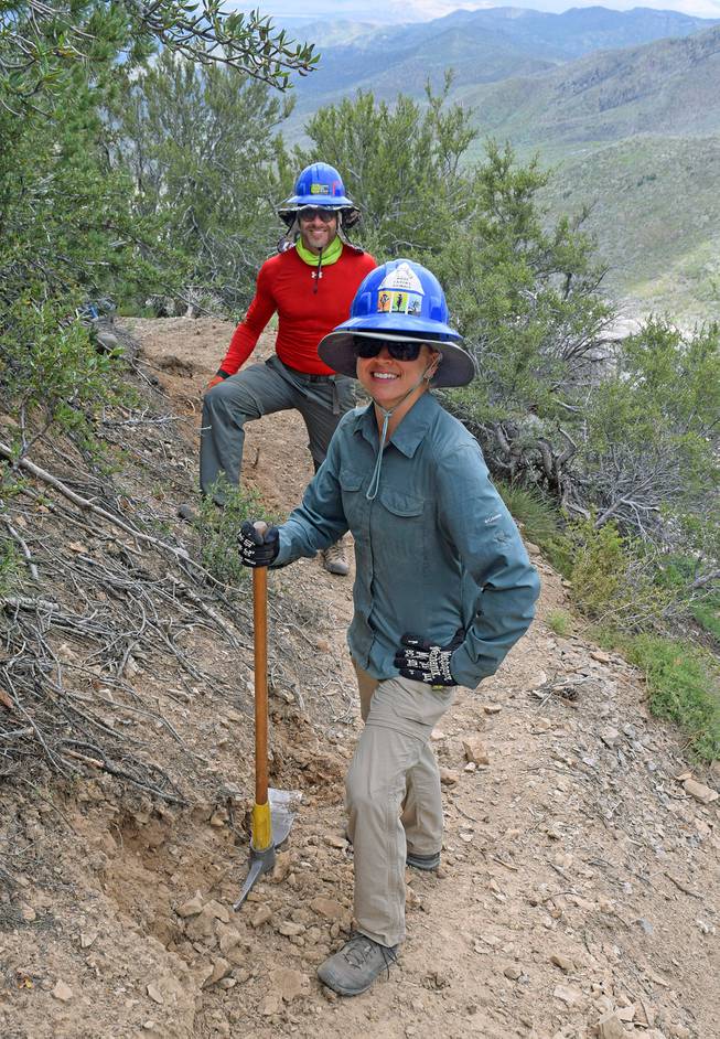 Volunteers Jake Newman and Chelsea Conlin assist with Griffith Peak Trail post-fire recovery efforts in 2018.