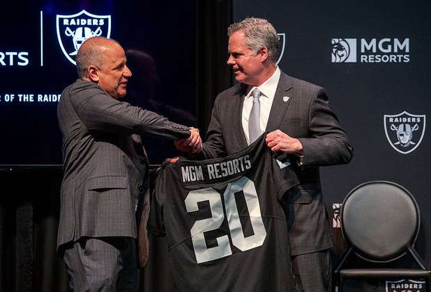 Jim Murren, right, chairman and CEO of MGM Resorts International, poses with Marc Badain, president of the Las Vegas Raiders, during a news conference at Mandalay Bay Thursday, Jan. 23, 2020. MGM Resorts International announced a founding partnership with the Las Vegas Raiders.