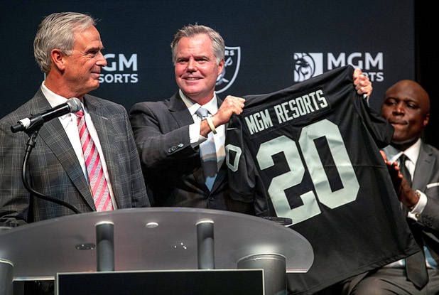 Jim Murren, center, chairman and CEO of MGM Resorts International, poses with Chuck Bowling, left, president and COO of Mandalay Bay, and Tony Gladney, vice president of community engagement for MGM Resorts, during a news conference at Mandalay Bay Thursday, Jan. 23, 2020. 