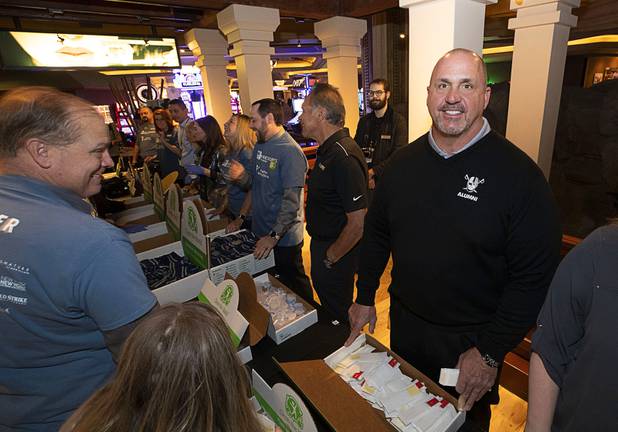 Raiders alumni Steve Wisniewski helps package hygiene kits for veterans before a news conference at Mandalay Bay Thursday, Jan. 23, 2020. Raiders representatives and MGM volunteers assembled 600 kits which will be given out at a Veterans Stand Down on March 25, said Shalimar Cabrera, executive director of U.S. Vets Las Vegas.