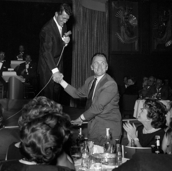Dean Martin introduces Kirk Douglas from the stage at the ...