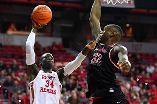 UNLV Rebels forward Cheikh Mbacke Diong (34) is defended by Fresno State Bulldogs forward Nate Grimes (32) during their NCAA Mountain West Conference basketball game Saturday, February 8, 2020, at the Thomas & Mack Center in Las Vegas. UNLV won the game 68-67 to end a four-game losing streak.