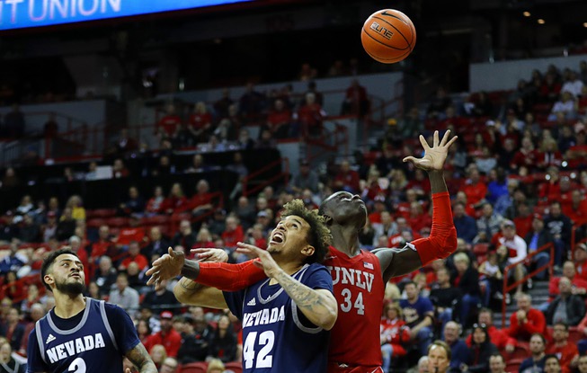 UNLV's Cheikh Mbacke Diong (34) fights for a rebound with ...