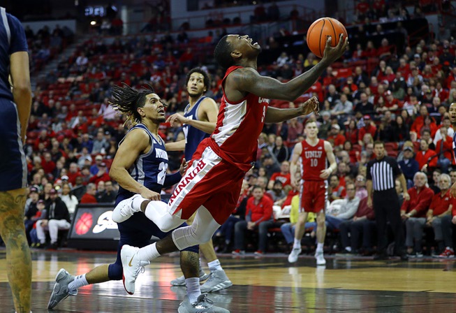UNLV's Amauri Hardy (3) lays up the ball during a ...