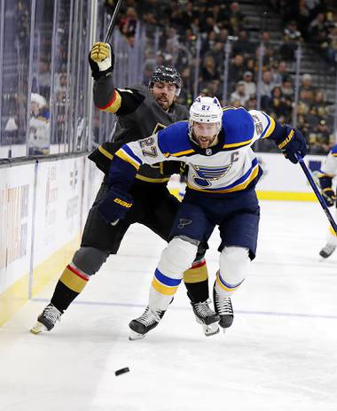 Vegas Golden Knights center Chandler Stephenson (20) and St. Louis Blues defenseman Alex Pietrangelo (27) skate down the ice during the second period of an NHL hockey game Thursday, Feb. 13, 2020, in Las Vegas.