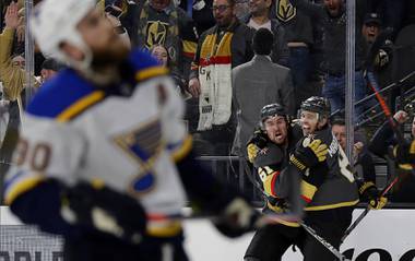 Vegas Golden Knights center Jonathan Marchessault, right, celebrates with right wing Mark Stone (61) after scoring a power-play goal against the St. Louis Blues in overtime of an NHL hockey game Thursday, Feb. 13, 2020, in Las Vegas. The Golden Knights won 6-5.