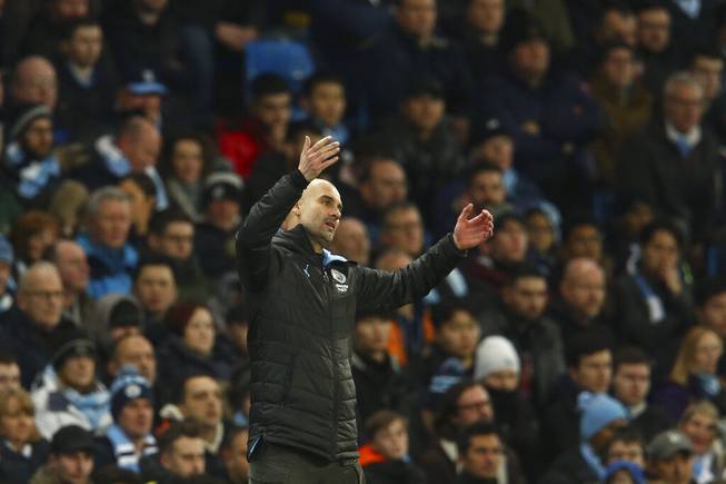 Manchester City's head coach Pep Guardiola gestures during the English League Cup semifinal second leg soccer match between Manchester City and Manchester United at Etihad stadium in Manchester, England, Wednesday, Jan. 29, 2020. 