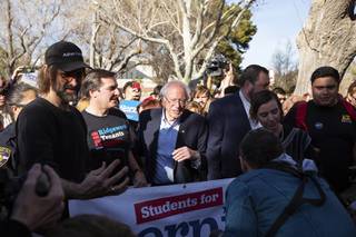 Democratic presidential candidate Sen. Bernie Sanders, I-Vt., leads supporters to an early voting location at the  University of Nevada, Las Vegas following an early vote rally Tuesday, Feb. 18, 2020, in Las Vegas.