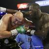 Tyson Fury, left, of England, fights Deontay Wilder during a WBC heavyweight championship boxing match Saturday, Feb. 22, 2020, in Las Vegas.