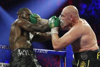 Tyson Fury, of England, lands a right to Deontay Wilder during a WBC heavyweight championship boxing match Saturday, Feb. 22, 2020, in Las Vegas.