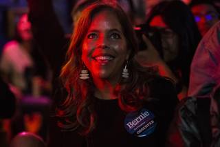 A supporter celebrates as Democratic presidential candidate Bernie Sanders is announced the winner of the Nevada 2020 Caucus during a Bernie 2020 Nevada Caucus Results Watch Party at ReBar in downtown Las Vegas Saturday, Feb. 22, 2020.