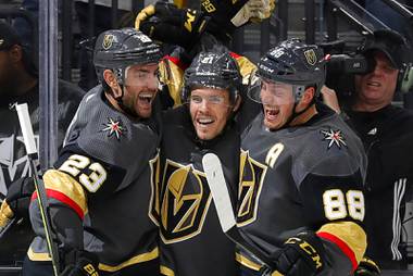 Vegas Golden Knights, from left, Alec Martinez (23), Nick Cousins (21) and Nate Schmidt (88) celebrate after Cousins’ goal during the third period of an NHL hockey game against the Edmonton Oilers at T-Mobile Arena in Las Vegas Wednesday, Feb. 26, 2020.