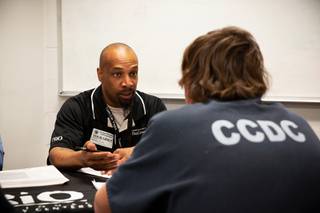 Terrell Daugherty,an academic counselor with UNLV, interviews an inmate during a transitioning event at the Clark County Detention Center, Wed Feb. 26, 2020. The event gathers multiple organizations, agencies and services in one area so that inmates, who will soon be released, can get help transitioning back to society.