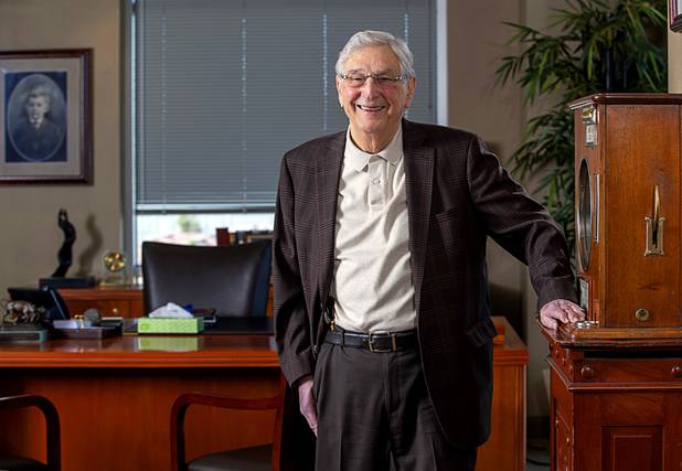 Bill Boyd, executive chairman and co-founder of Boyd Gaming, poses by a vintage gambling machine in his office Tuesday, March 3, 2020.