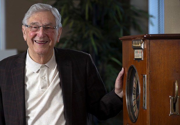 Bill Boyd, executive chairman and co-founder of Boyd Gaming, poses by a vintage gambling machine in his office Tuesday, March 3, 2020.