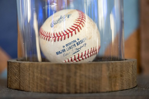 A baseball is displayed on a wall shelf in the BetMGM sports book at the Park MGM Friday, March 6, 2020.