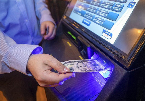 Ivan Souffront, a senior product manager for Roar Digital, make a sports bet using a self-service kiosk in the BetMGM sports book at the Park MGM Friday, March 6, 2020.