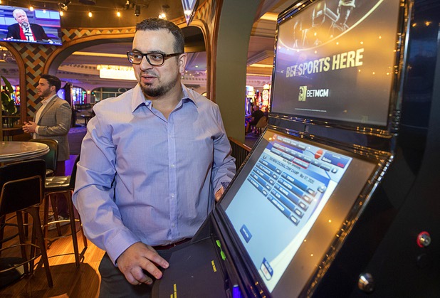 Ivan Souffront, a senior product manager for Roar Digital, demonstrates a self-service sports betting kiosk in the BetMGM sports book at the Park MGM Friday, March 6, 2020.