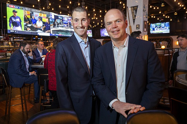 Scott Butera, left, president of interactive gaming at MGM Resorts International, and Matt Prevost, chief marketing officer for Roar Digital, pose in the BetMGM sports book at the Park MGM Friday, March 6, 2020.