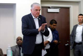 Nevada Gov. Steve Sisolak uses hand sanitizer before a briefing on coronavirus (COVID-19) cases in Nevada at the Sawyer State Building Saturday, March 7, 2020.