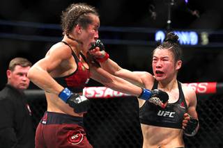 Zhang Retains Title With Split Decision